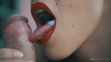 Girl with red lipstick pumps cock in her mouth