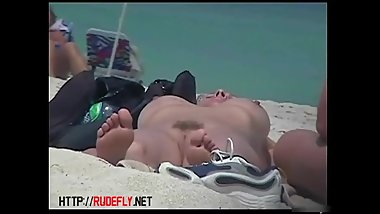 Hot beach amateur gets her tits bouncing on spy cam